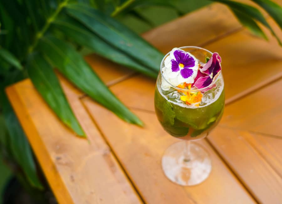 Green summer cocktail with flowers